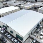 New Metal Roof installation on commercial warehouse building.