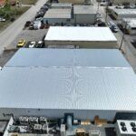 New Metal Roof installation on commercial warehouse building.