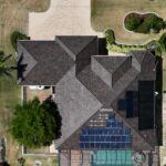 Brown Brava Roofing Shingles installed on beautiful residential home with new solar panel installation.